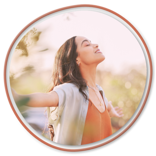 Joyful woman embracing the sunlight